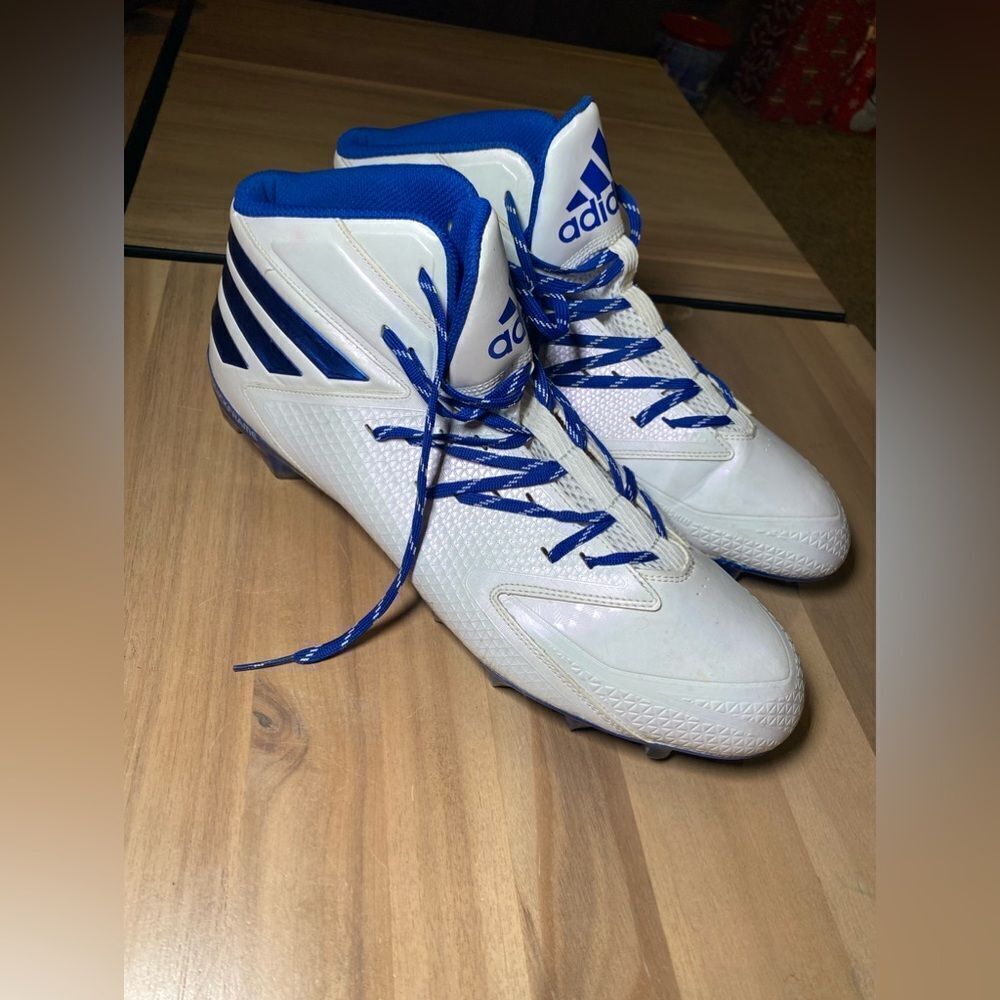 Adidas blue and white cleats